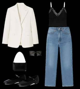Flat lay of a white blazer, a black lace cami, jeans, a small bag and flats