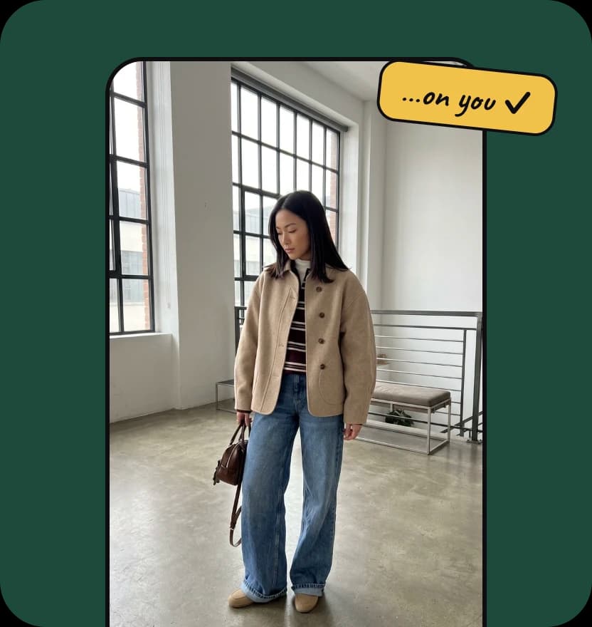 A phone-style frame showing a woman in a camel jacket and jeans, tagged “…on you ✓”, on a dark green background.